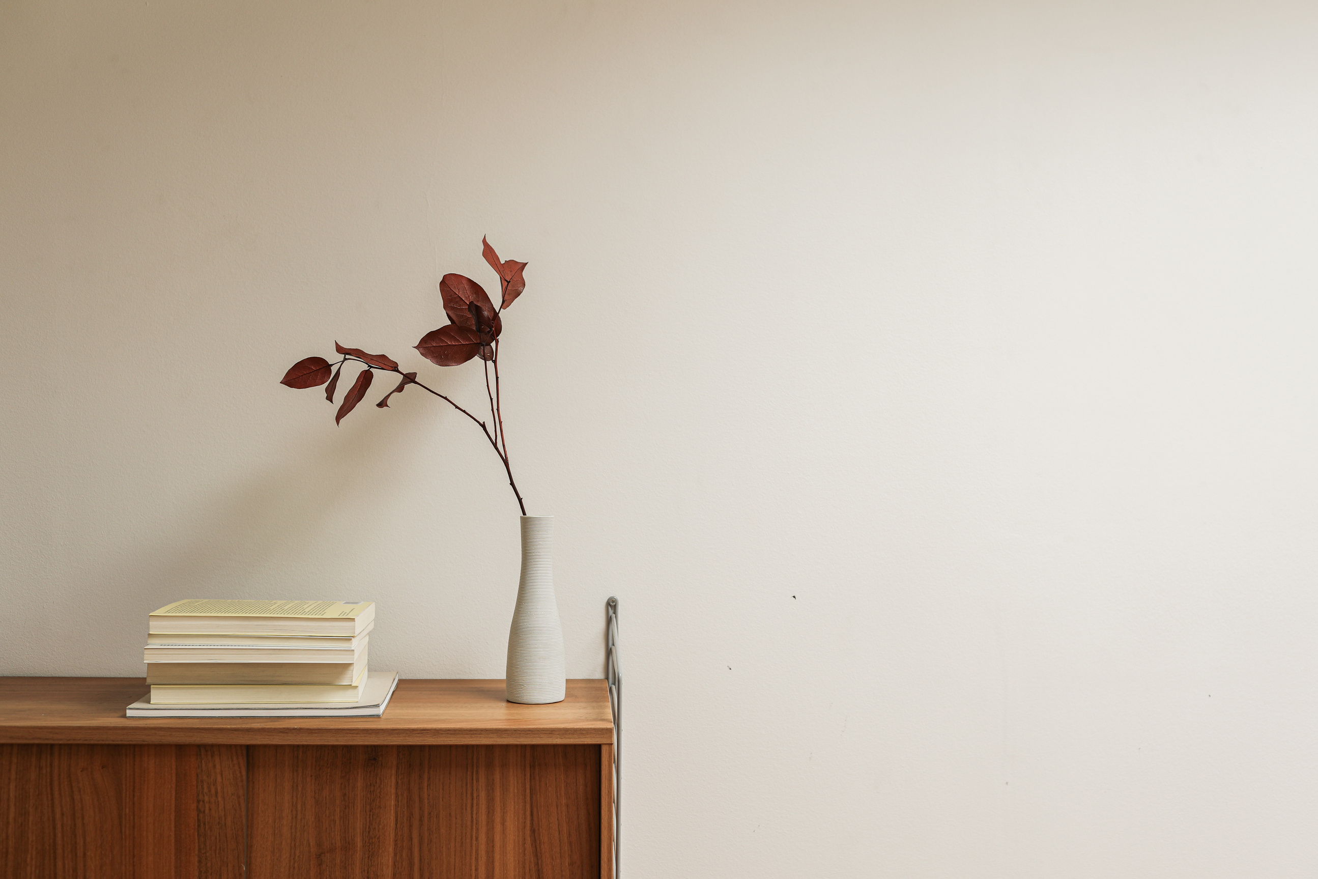 Ceramic Vase and Books on Wooden Table